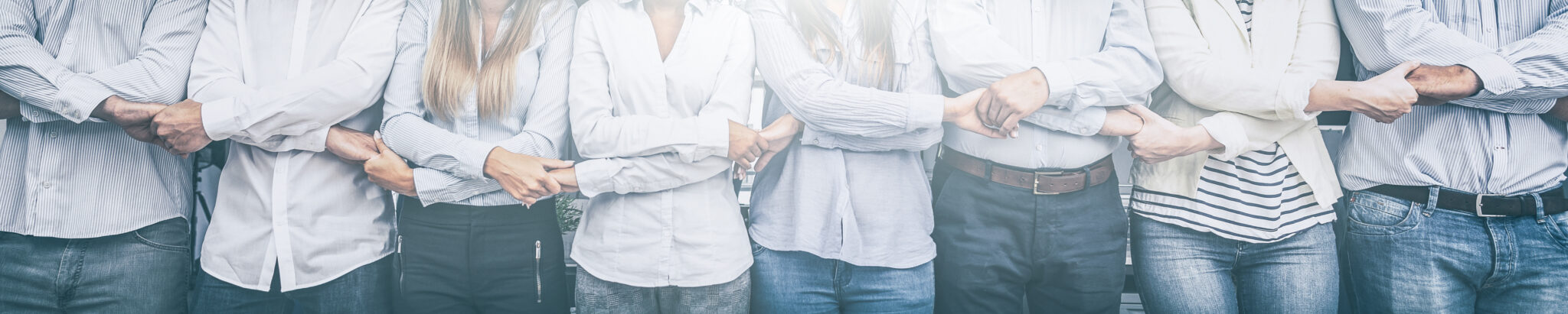 A row of joined hands, a symbol of collective work